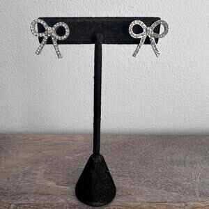 Silver tone pave rhinestone studded sparkly fancy elegant bow post stud earrings